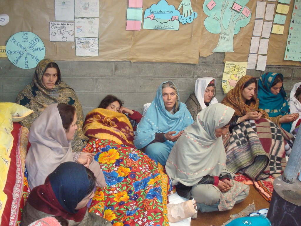 An injured girl rests alongside other women at a relief camp housed in a school. Photo: Courtesy of FOCUS