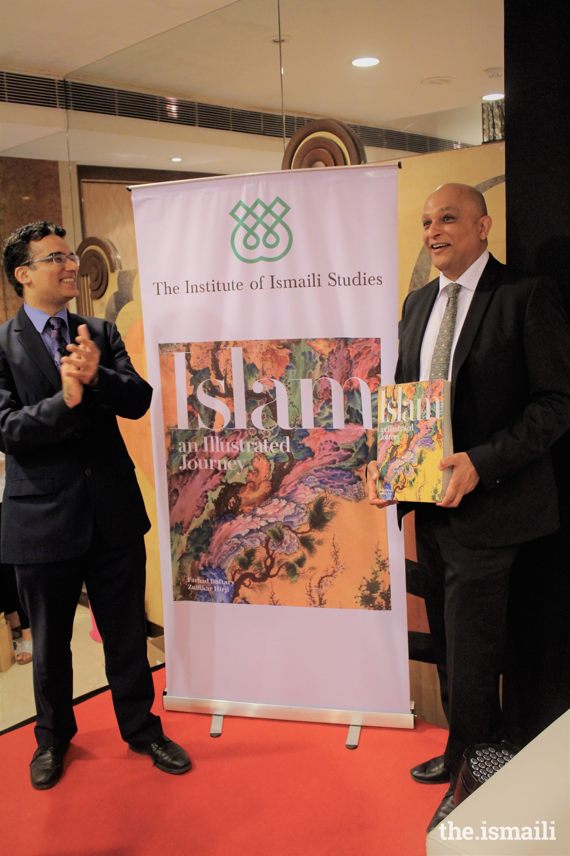 Professor Zulfikar Hirji, co author presents the book whilst Mr. Ashish Merchant, President, Council for India looks on