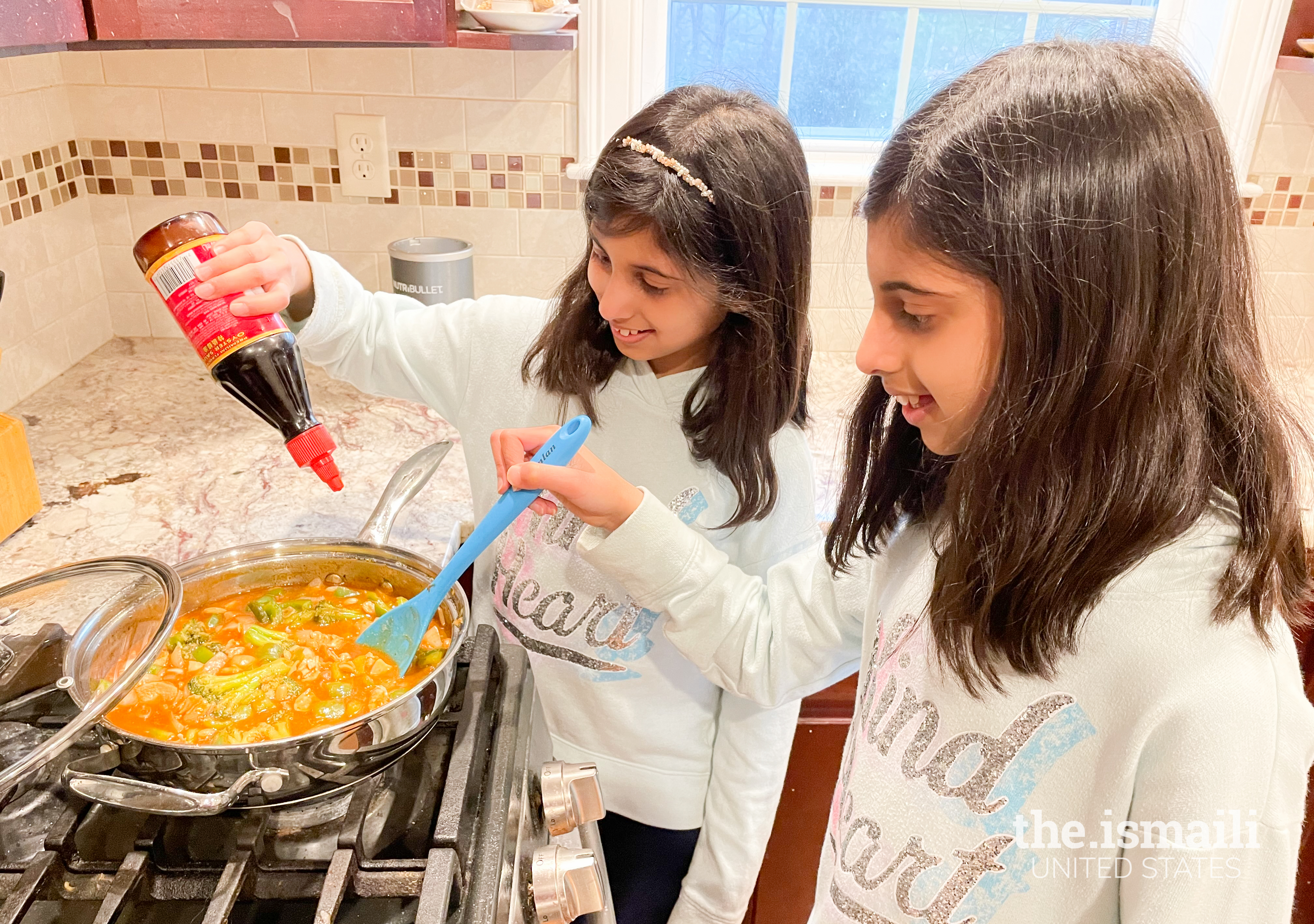 Simal & Sophia learning how to cook through a virtual class.