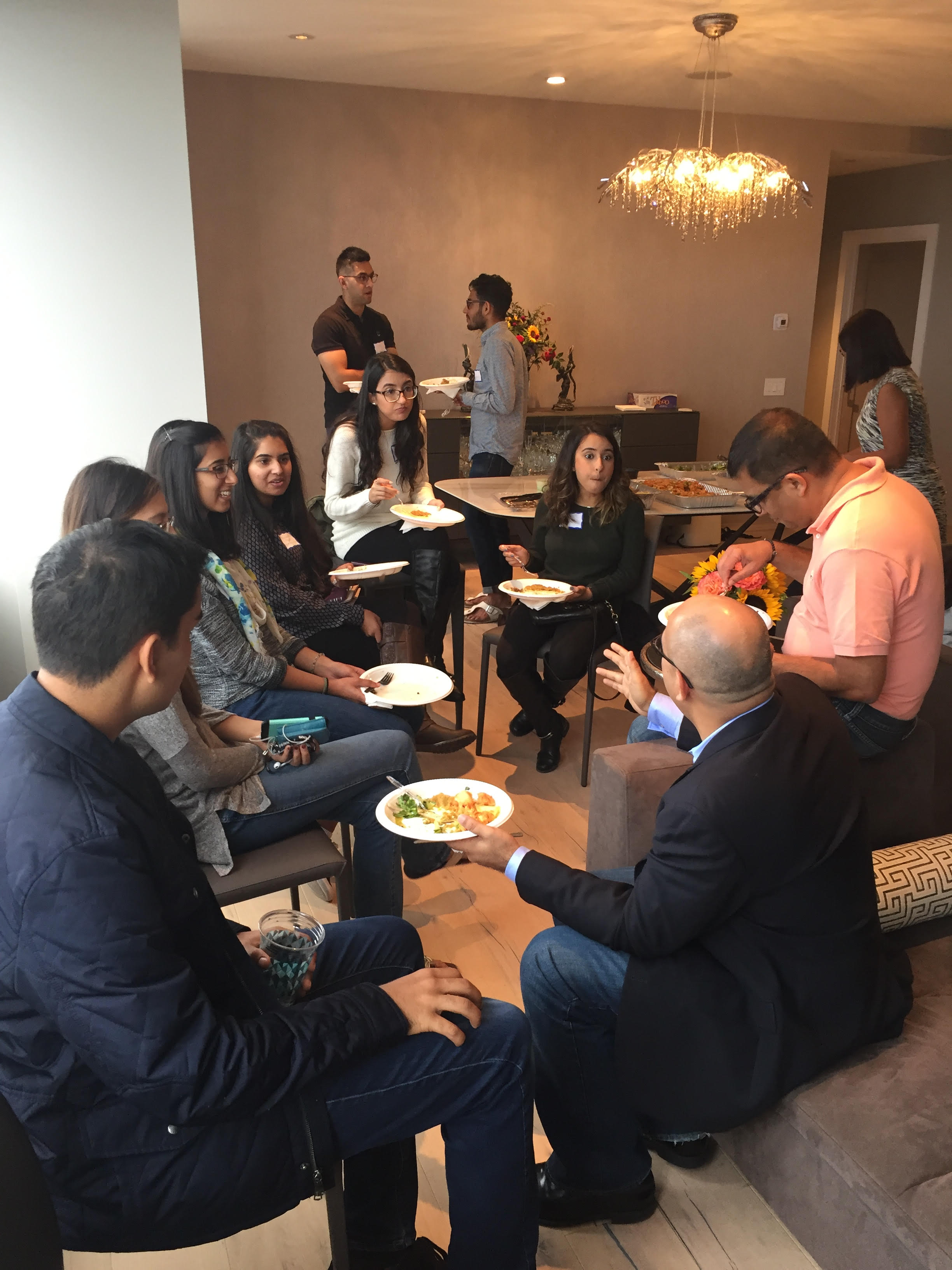 Ismaili Council for the Northeastern USA President Shajahan Merchant and Northeast ITREB Chairman Hanif Ebrahim in conversation with college students at the Philadelphia Welcome Lunch.