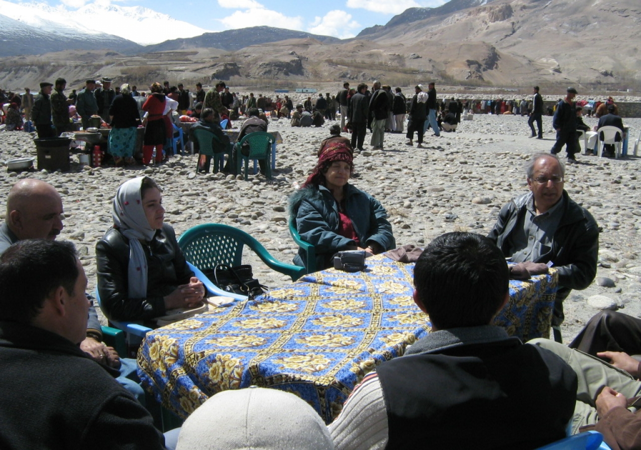 Nashir Karmali (right) attends a meeting with the Afghan Ishkashim team at the Border Market.