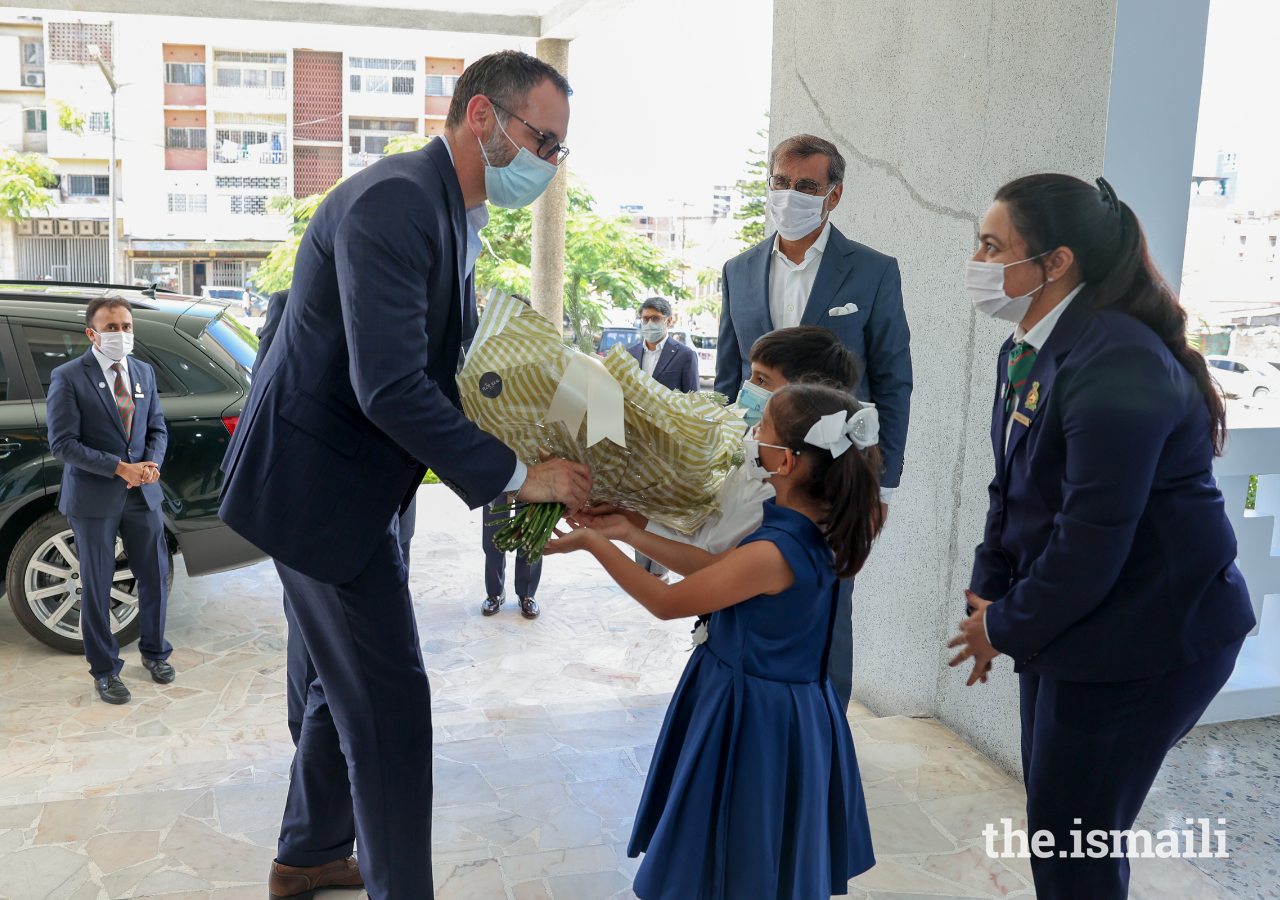 Prince Rahim is greeted by Bait-ul Ilm students upon arrival to Maputo Jamatkhana on 18 March 2022.