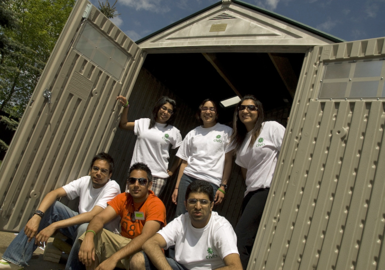 Edmonton youth pose outside one of the sheds they built in partnership with Habitat for Humanity. 