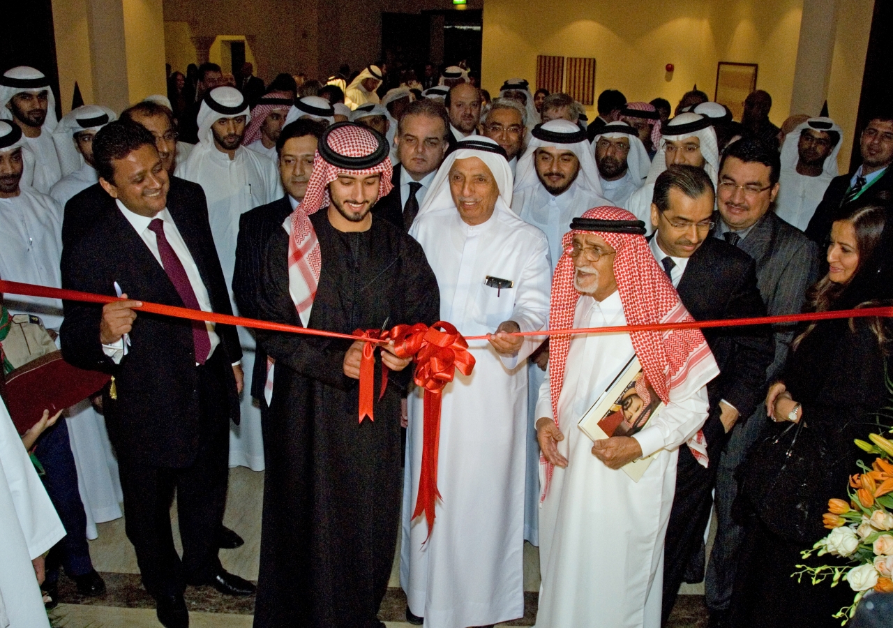 His Highness Sheikh Majid inaugurates the exhibition. He is joined by prominent UAE businessman Juma Al Majid and Royal Photographer Noor Ali Rashid, as Ismaili Council President Naushad Rashid and other Jamati leaders and guests look on.