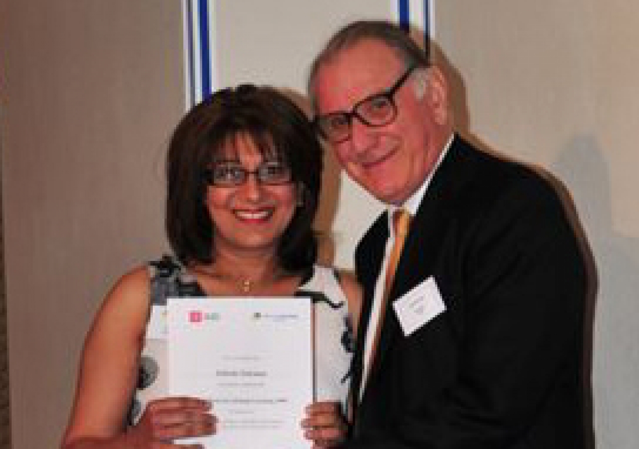 Zubeda Suleman receives her Lifelong Learning certificate from Keith Mackrell, Governor and Honorary Fellow of the LSE.