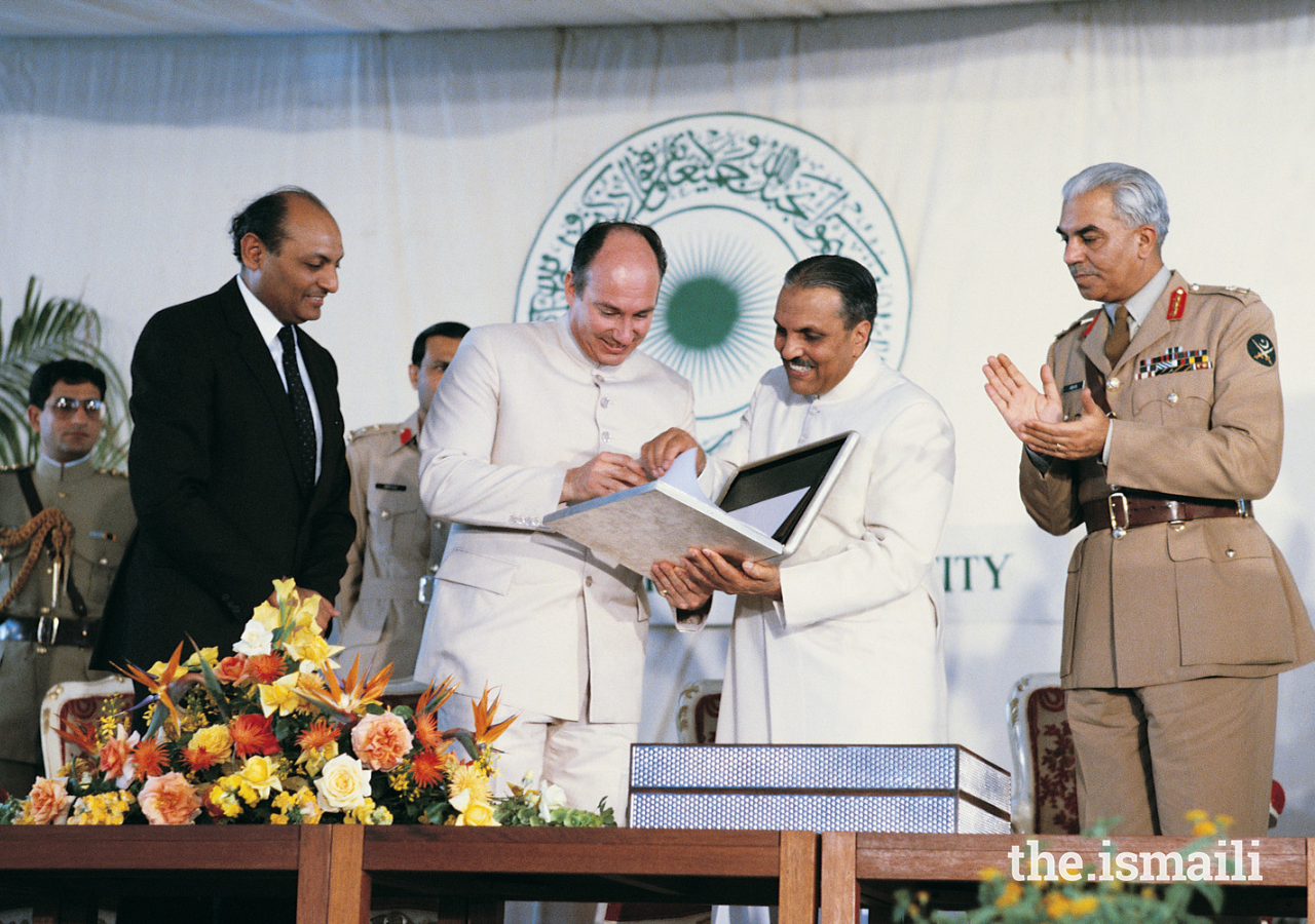 Mawlana Hazar Imam receives the Charter of the Aga Khan University from the President of Pakistan in 1983.