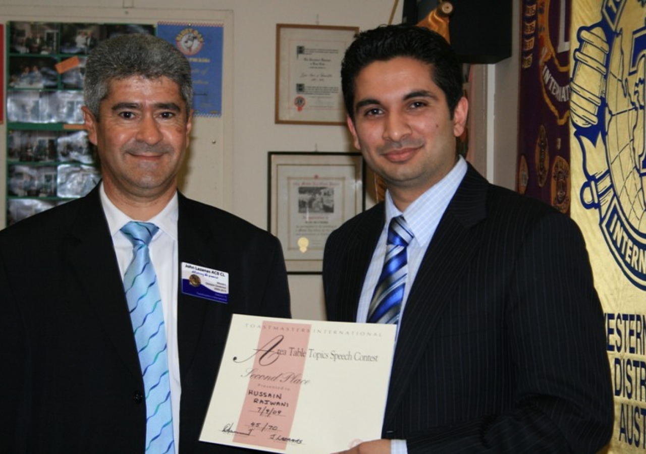 Hussain Rajwani (right) of Sydney, Australia was awarded second prize in a Toastmasters divisional competition.