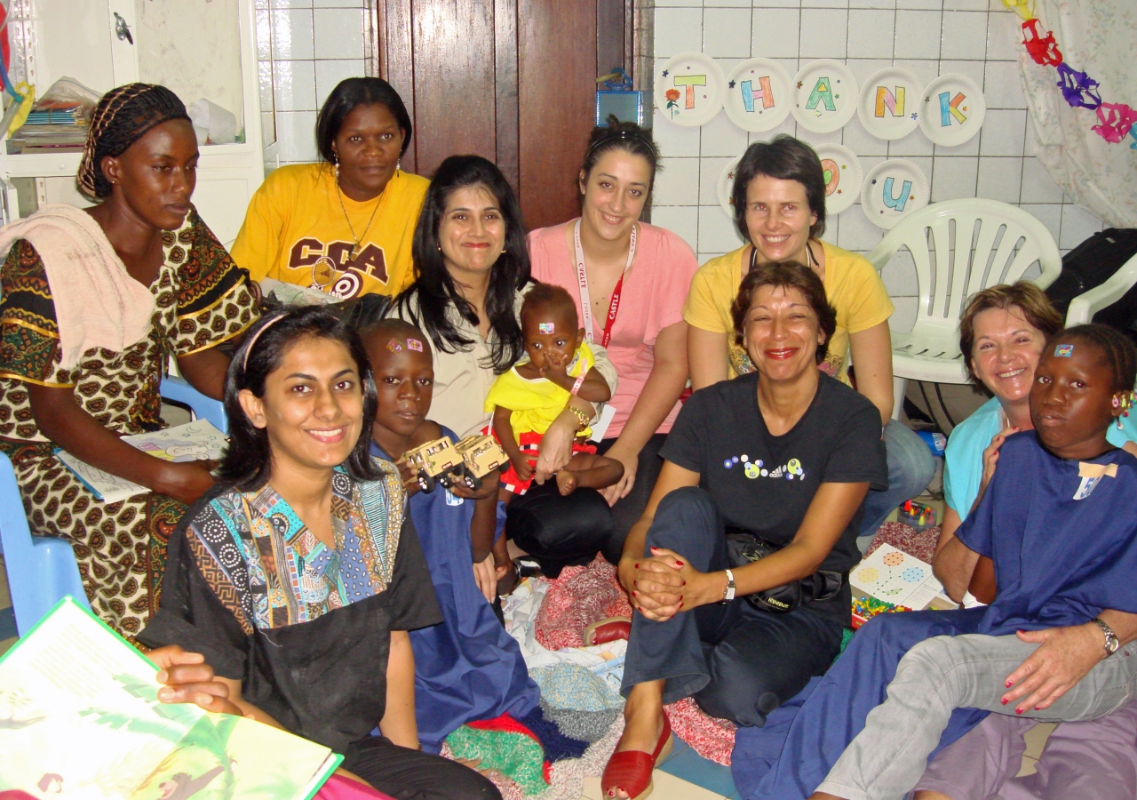 Some of the volunteers assisting the Operation Smile mission in Kinshasa gather in the children&#039;s nursery.