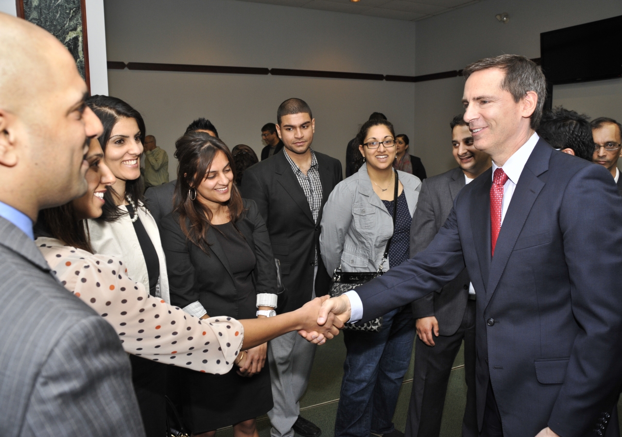 Ismaili volunteers and young leaders greet Premier Dalton McGuinty.