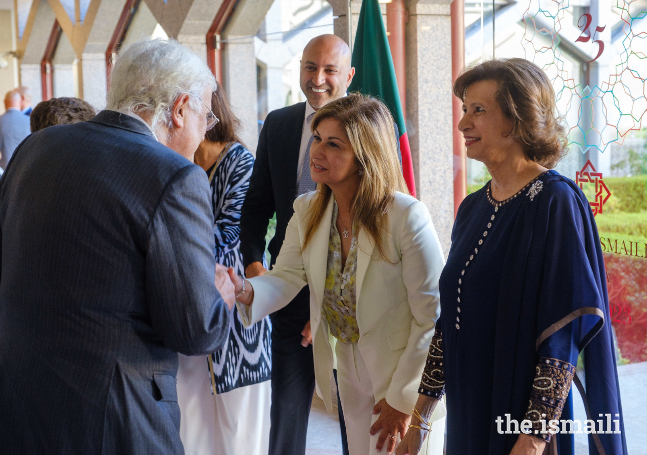 President of the Ismaili Council for Portugal, Yasmin Bhudarally, welcomes a guest to the event to celebrate 25 years of the Ismaili Centre Lisbon.
