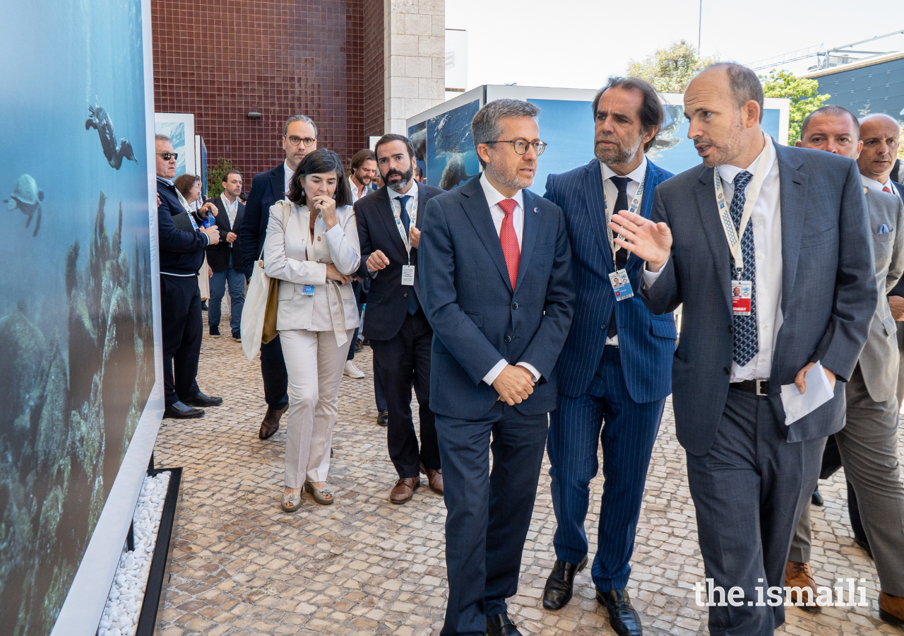 Prince Hussain gives Carlos Moedas, Mayor of Lisbon, and Miguel Albuquerque, President of the Regional Government of Madeira, a guided tour of his Fragile Beauty exhibition of marine photography at the Portugal Pavilion in Lisbon.