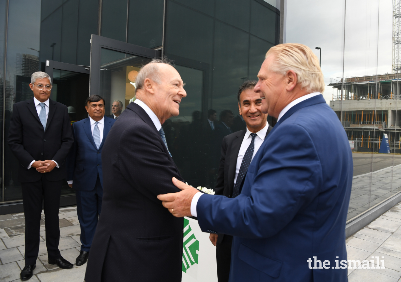 Prince Amyn welcomes Ontario Premier Doug Ford to the future site of Generations Toronto, as Ameerally Kassim-Lakha, President of the Ismaili Council for Canada looks on.
