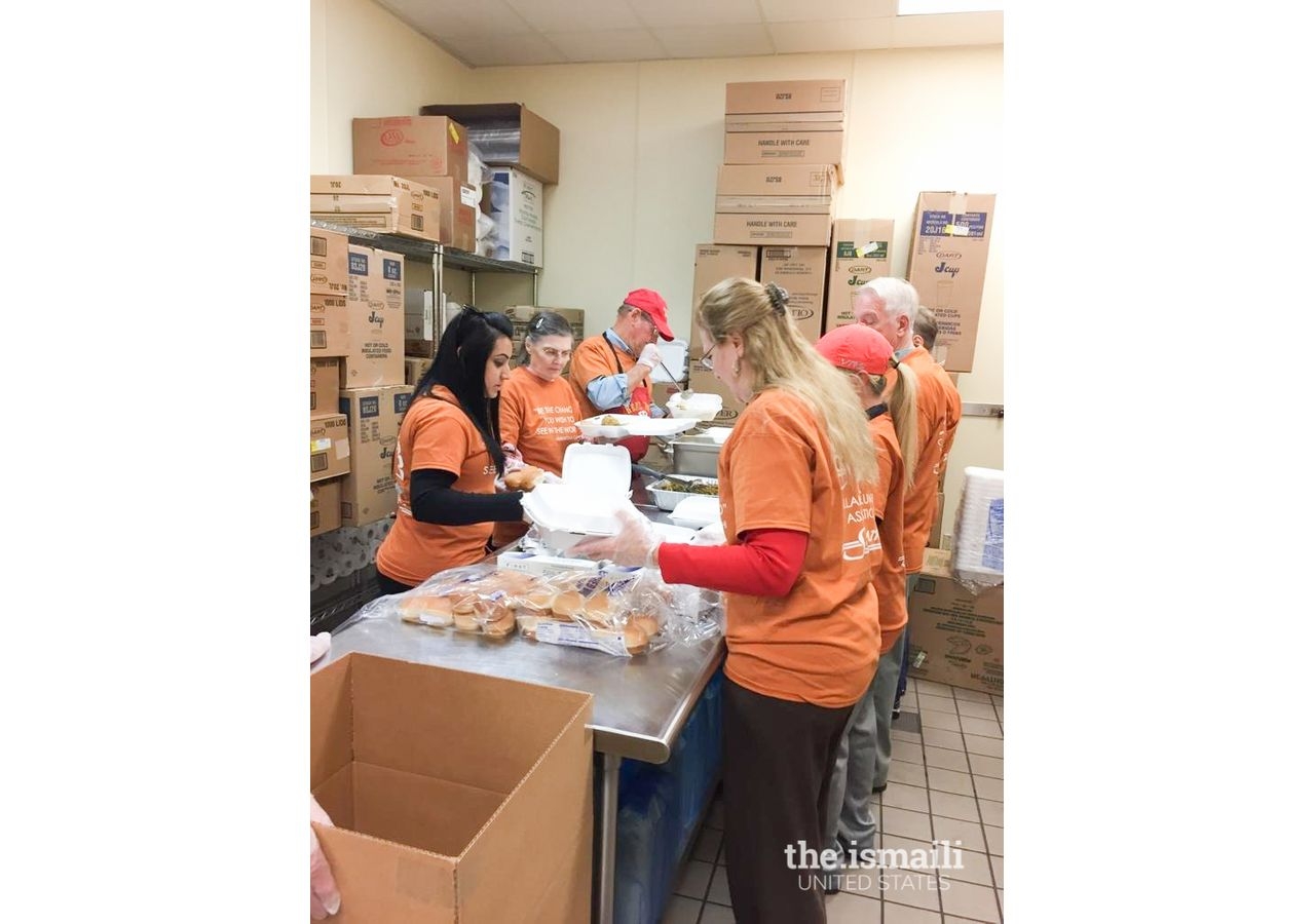 Volunteers preparing one of 3,500 meals to be distributed for Thanksgiving.