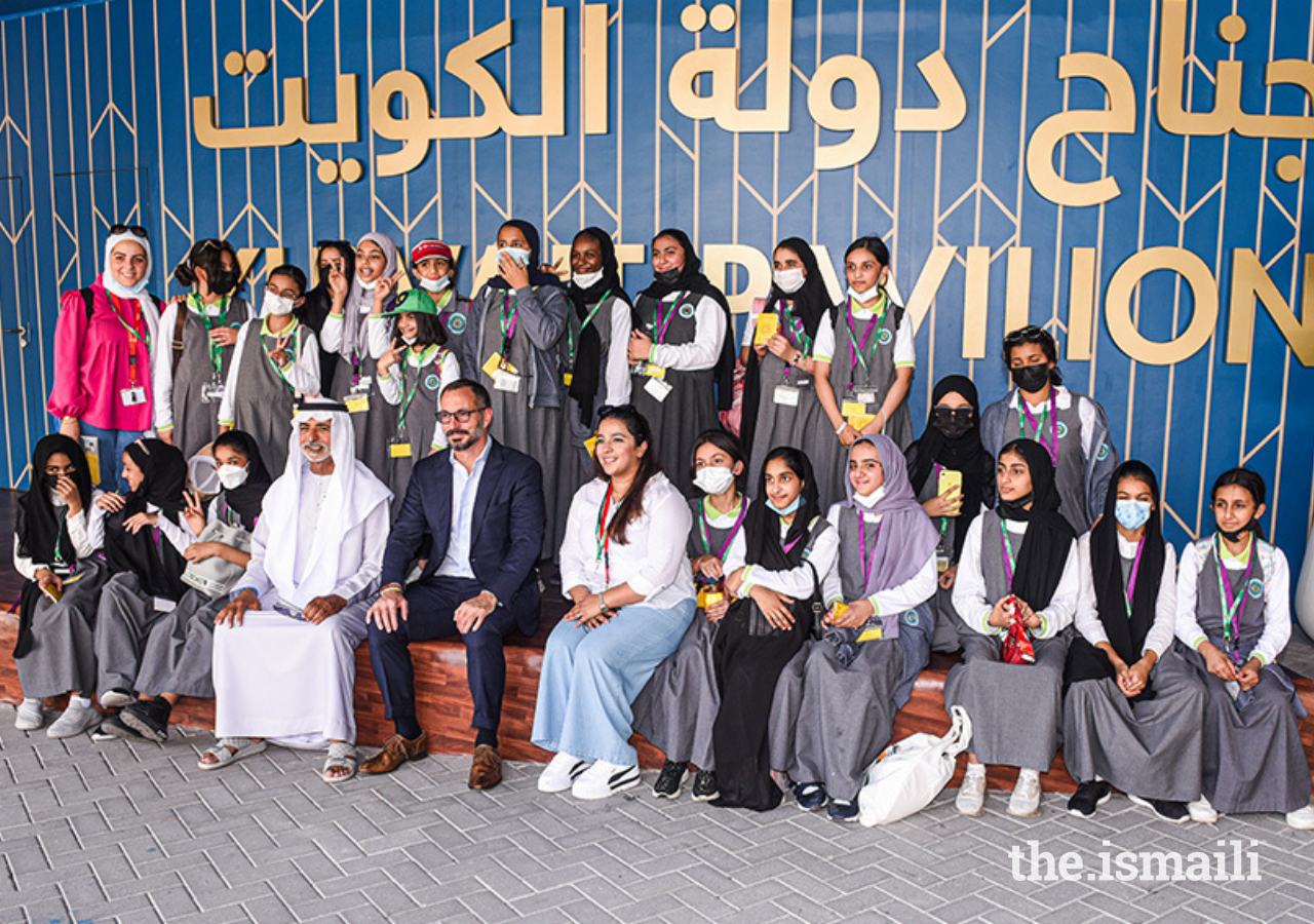 Prince Rahim poses for a photograph with His Excellency Sheikh Nahayan and a group of schoolchildren at Expo 2020 in Dubai.