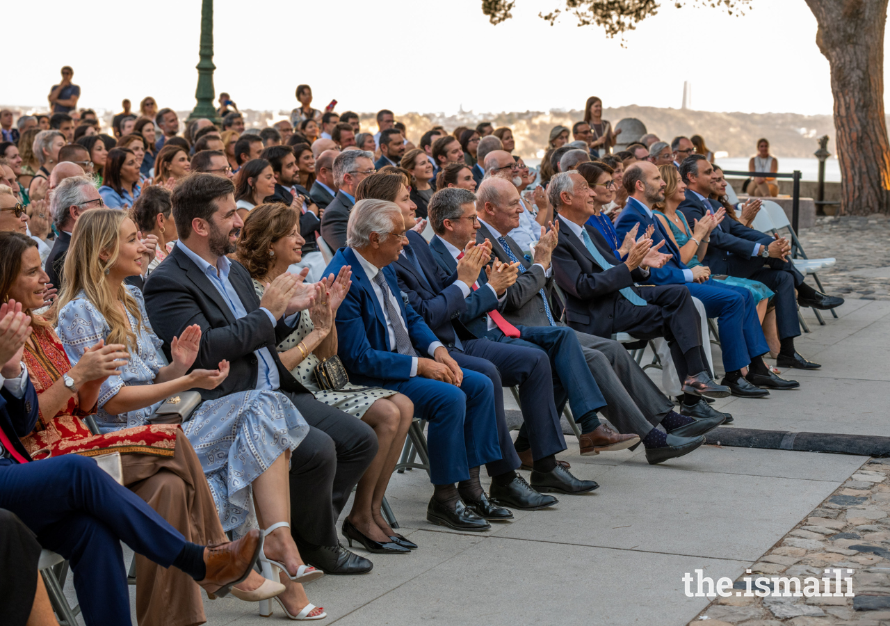 Attendees applaud the Aga Khan Master Musicians and guest artists during their performance at Castelo São Jorge on 8 July 2022.