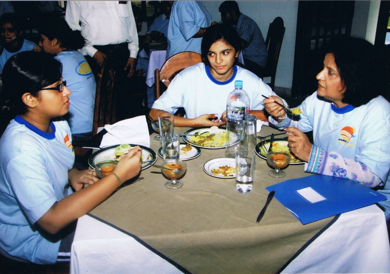 Participants with counselor during a lunch session 