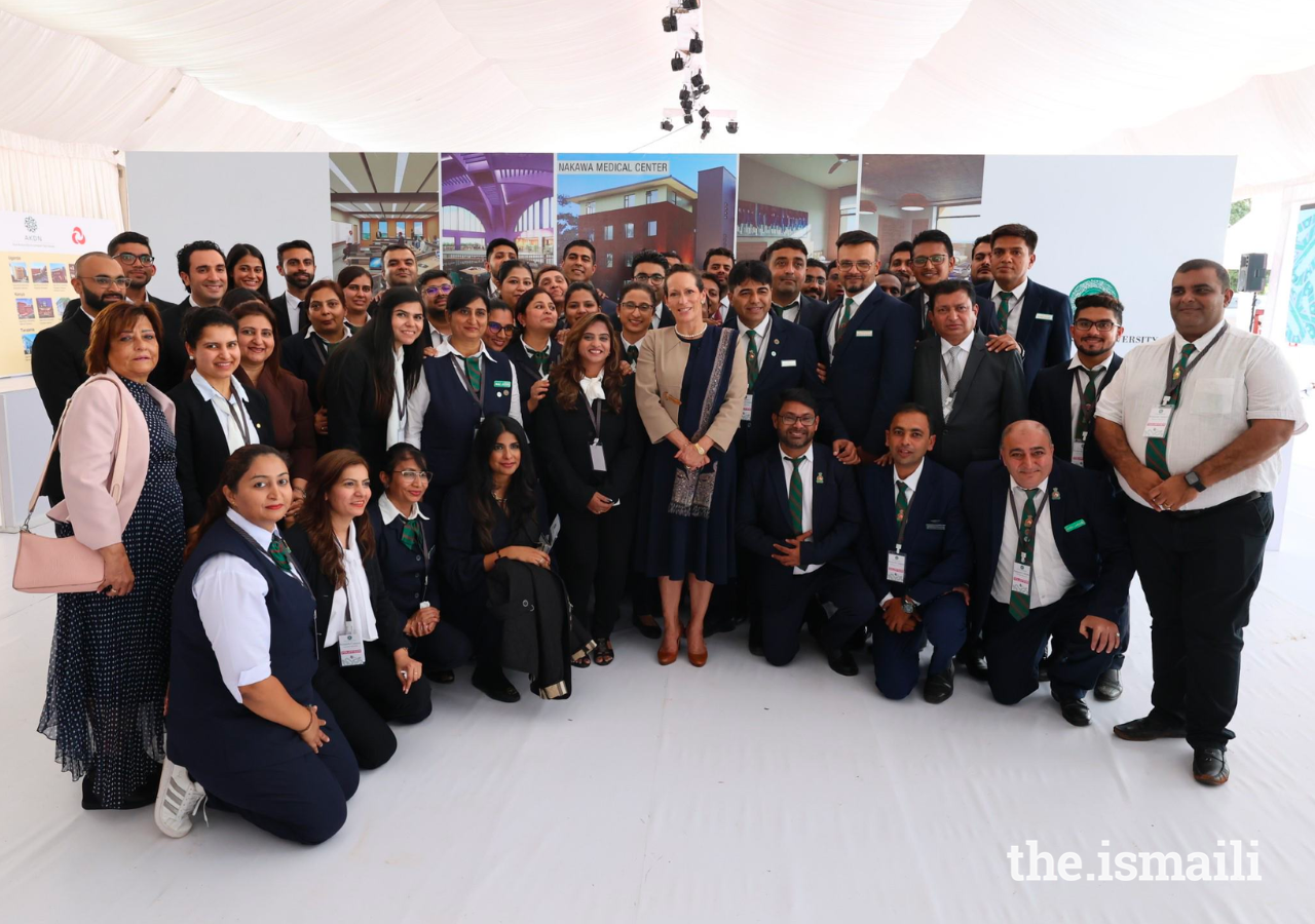 Princess Zahra poses for a photo with uniformed volunteers after the event celebrating the beginning of construction of the Aga Khan University’s new Kampala campus.