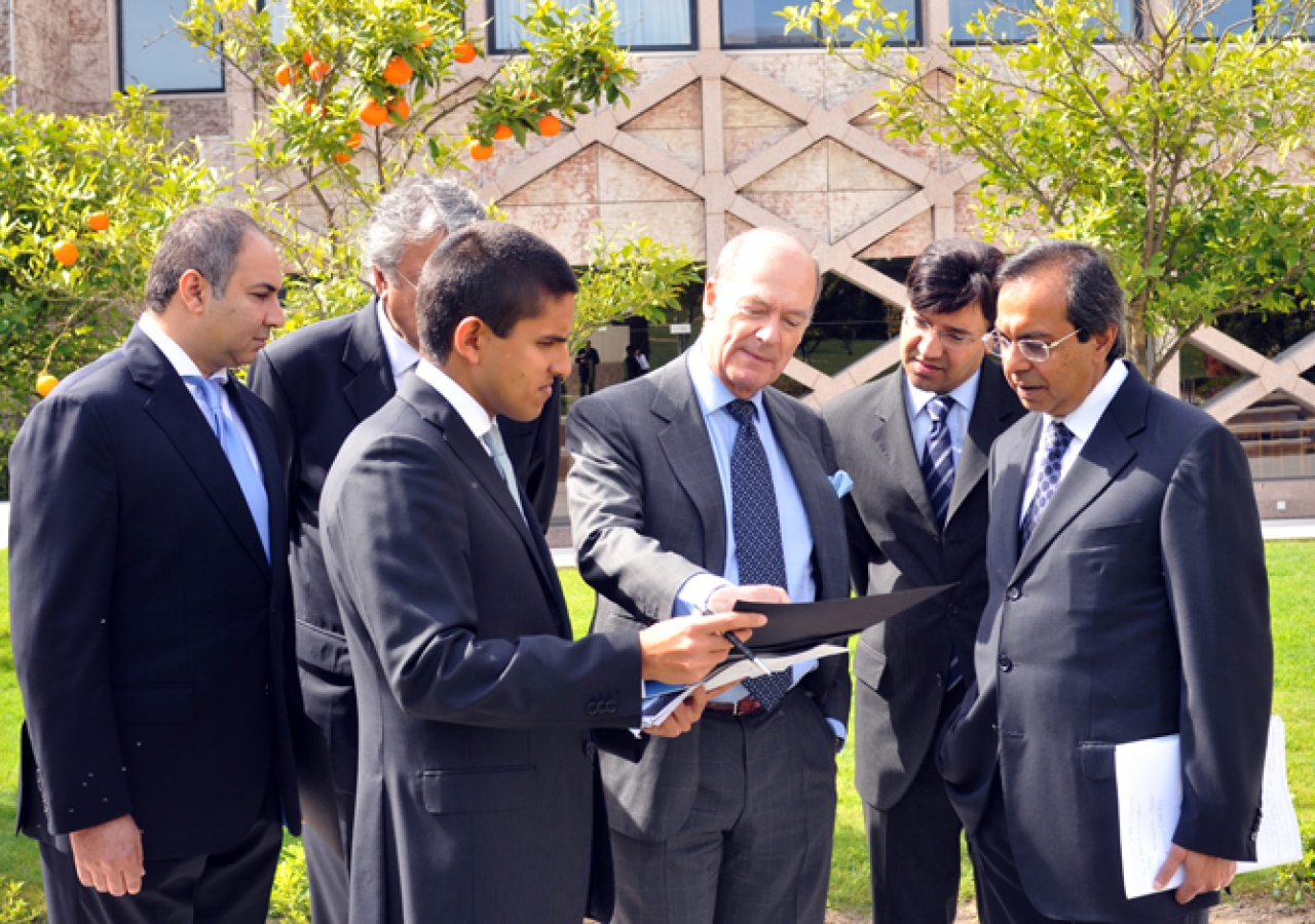 Prince Amyn inspects plans at the Centro Ismaili in Lisbon with President Amirali Bhanji of the Ismaili Council for Portugal, Rahim Kara, the Centro Ismaili building manager and other senior management.    