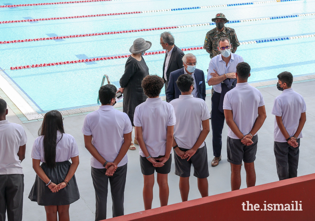 Prince Rahim speaks with students during a tour of the sports facilities at the Aga Khan Academy Maputo.
