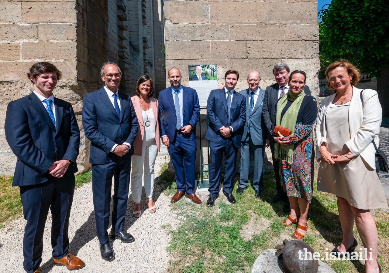 (L to R): Iliyan Boyden, Eric Woerth, Isabelle Wojtowiez, Prince Hussain, Prince Aly Muhammad, Prince Amyn, Xavier Darcos, Princess Zahra, and Florence Woerth pose for a photograph with the plaque.