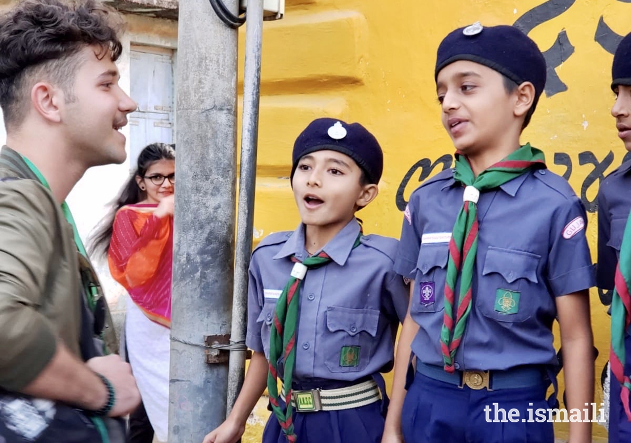Ibrahim Basha, a GE Expedition participant from Dubai, connects with young Ismaili scouts in Chitravad.