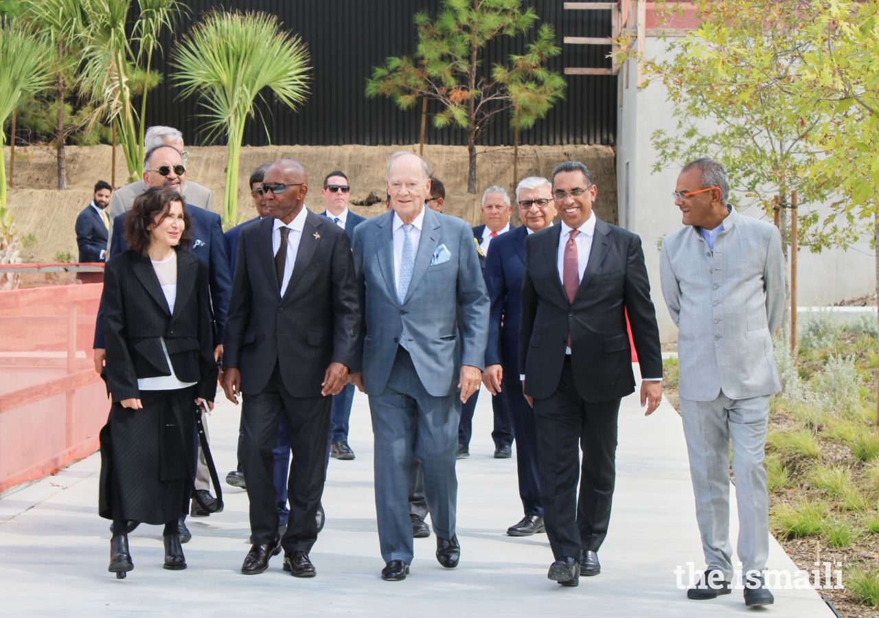 Prince Amyn, joined by (left to right) design architect Farshid Moussavi, Mayor Sylvester Turner, Ismaili Council for USA President Al-Karim Alidina, and structural engineer Hanif Kara, as they arrive for the topping out ceremony at the site of the Ismaili Center.