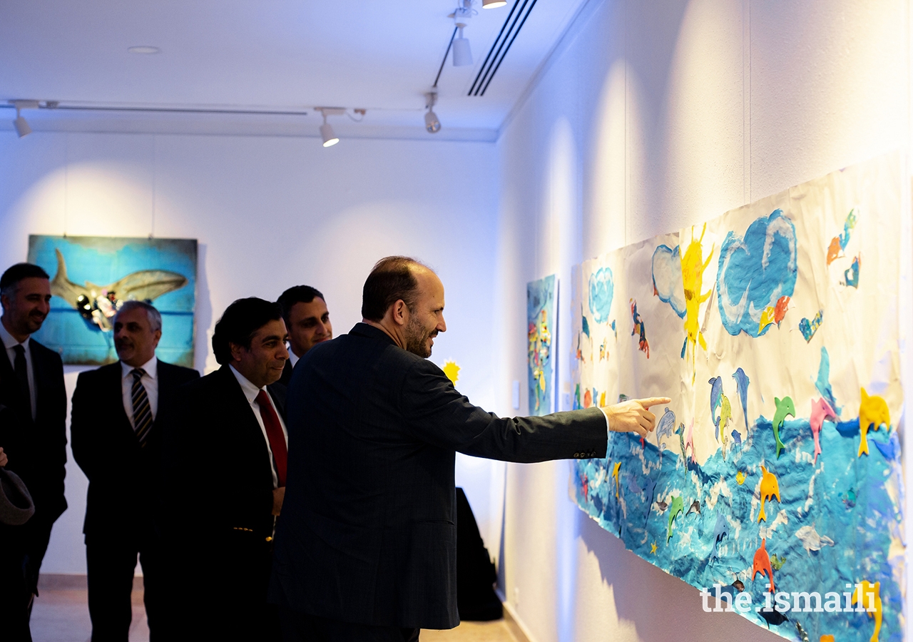 Prince Hussain views artwork designed by students from the Portugal Jamat’s Talim (religious education) classes at the Ismaili Centre, Lisbon.