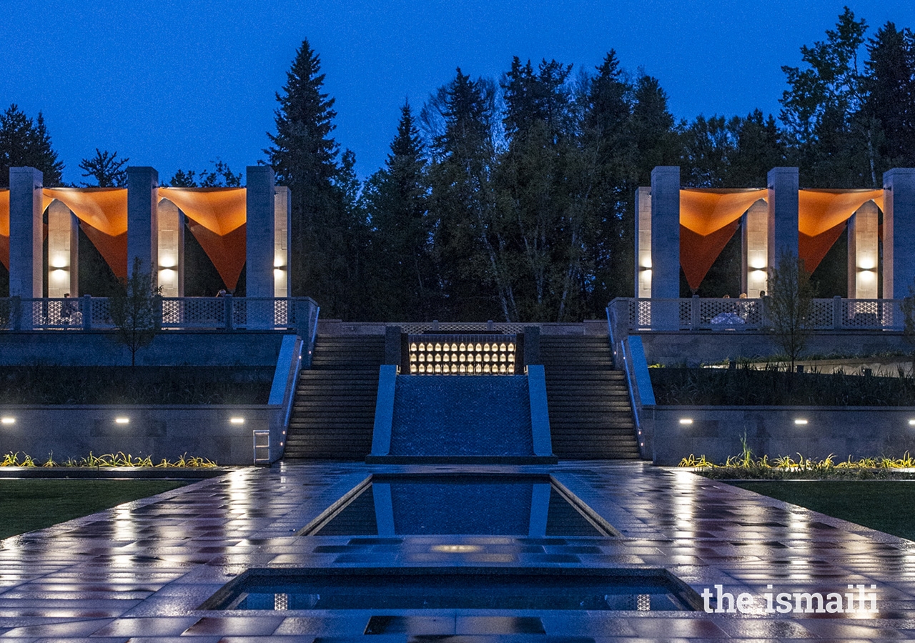 The brilliant burnt orange canopies on the upper Talar columns are lit up at night.