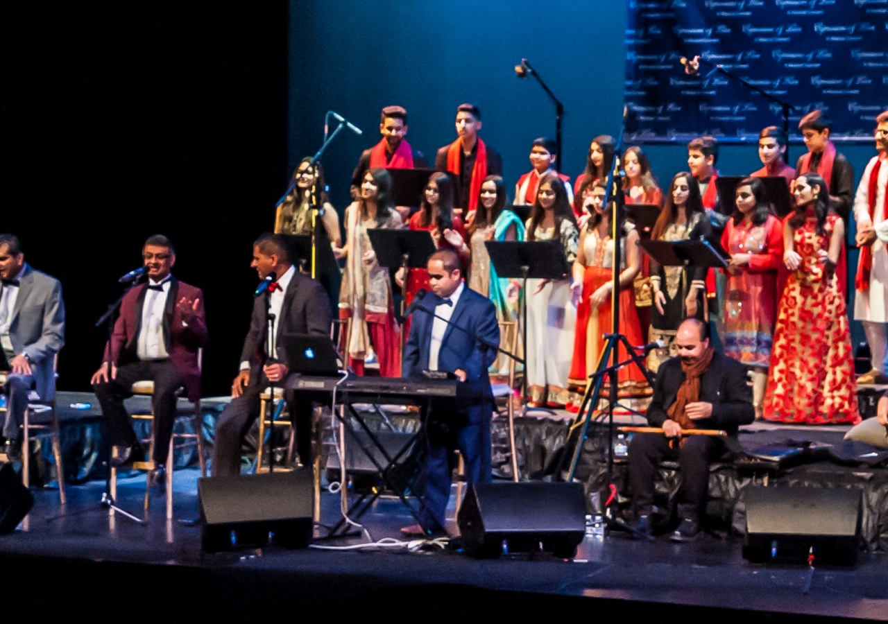 The ensemble: Front from the Left - Shahnawaz Meghani, Imran Boodhwani, Fez Meghani, Aftab Ali, Pervaiz Mirza, Jatinder Parkash, Anwar Khurshid. Back: Ismaili Youth Choir of Southern California