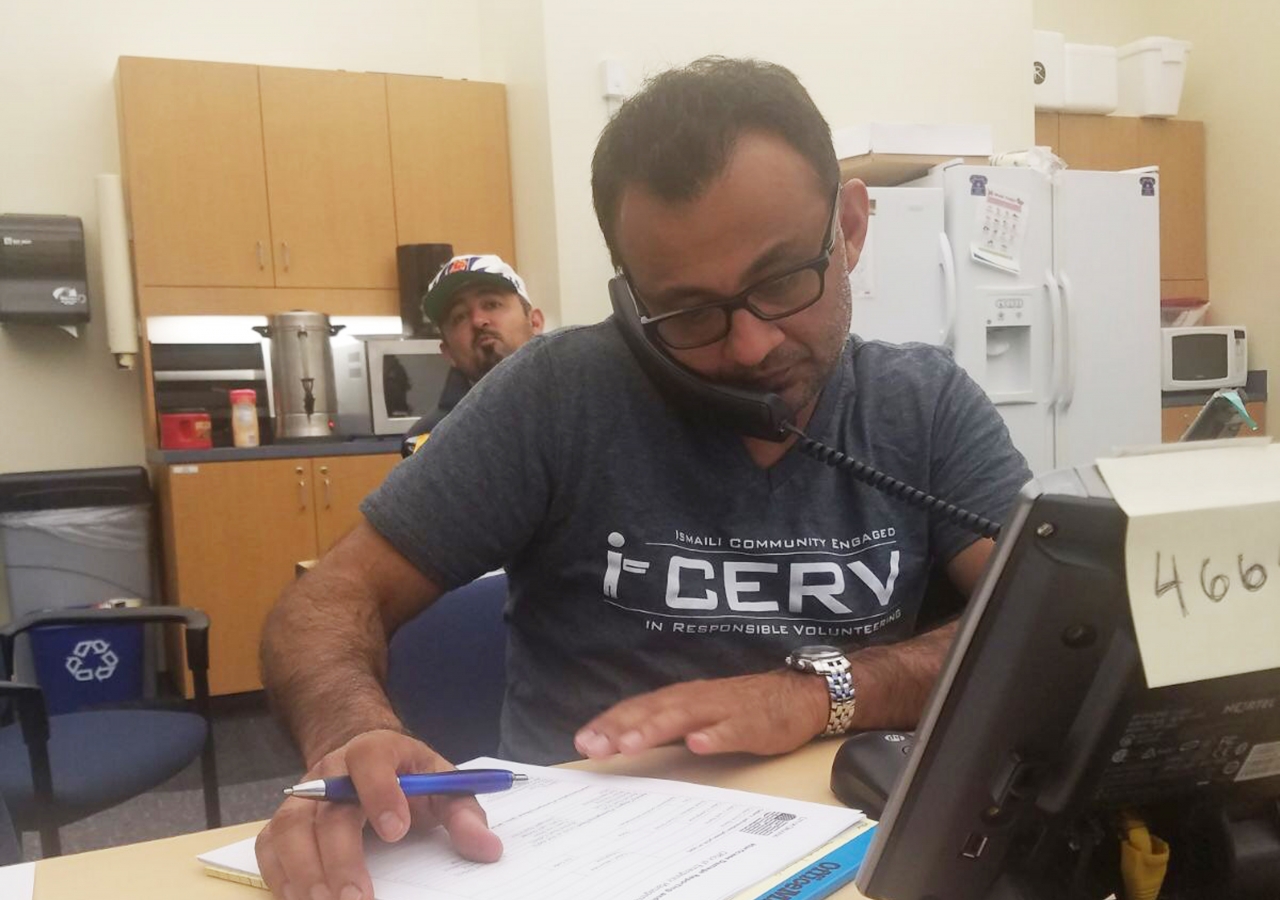 Abdullah Tharoo on a call with an Orlando resident after Hurricane Irma.