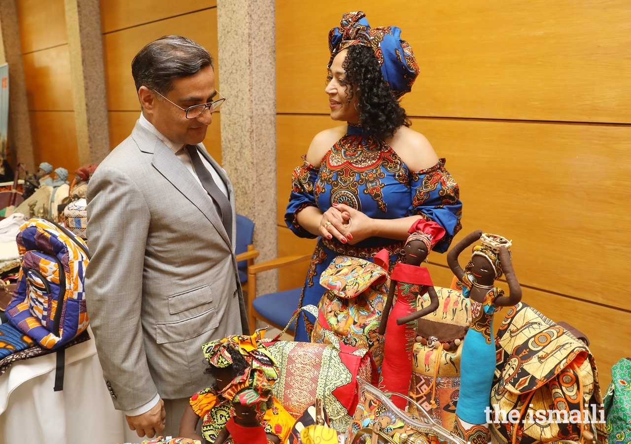 Amin Rawjee, President of the local council for Mozambique, views artefacts at the African craft fair.