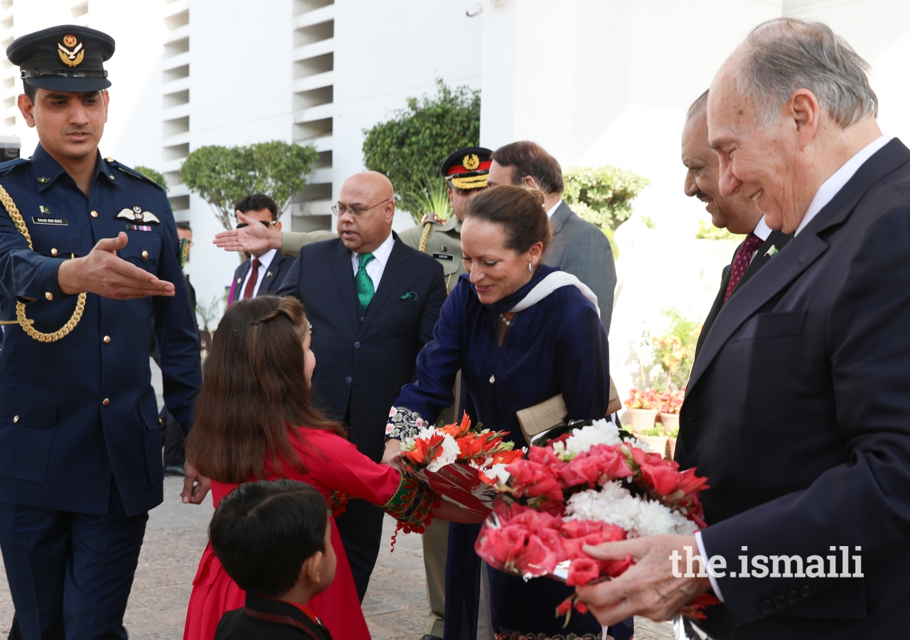Princess Zahra is presented with a bouquet of flowers upon arrival at the Aiwan-e-Sadr 