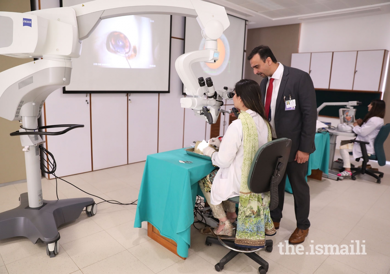 Dr Irfan Jeeva, associate professor in the ophthalmology department, guides a trainee during an eye surgery simulation at CIME’s advanced skills simulation lab.