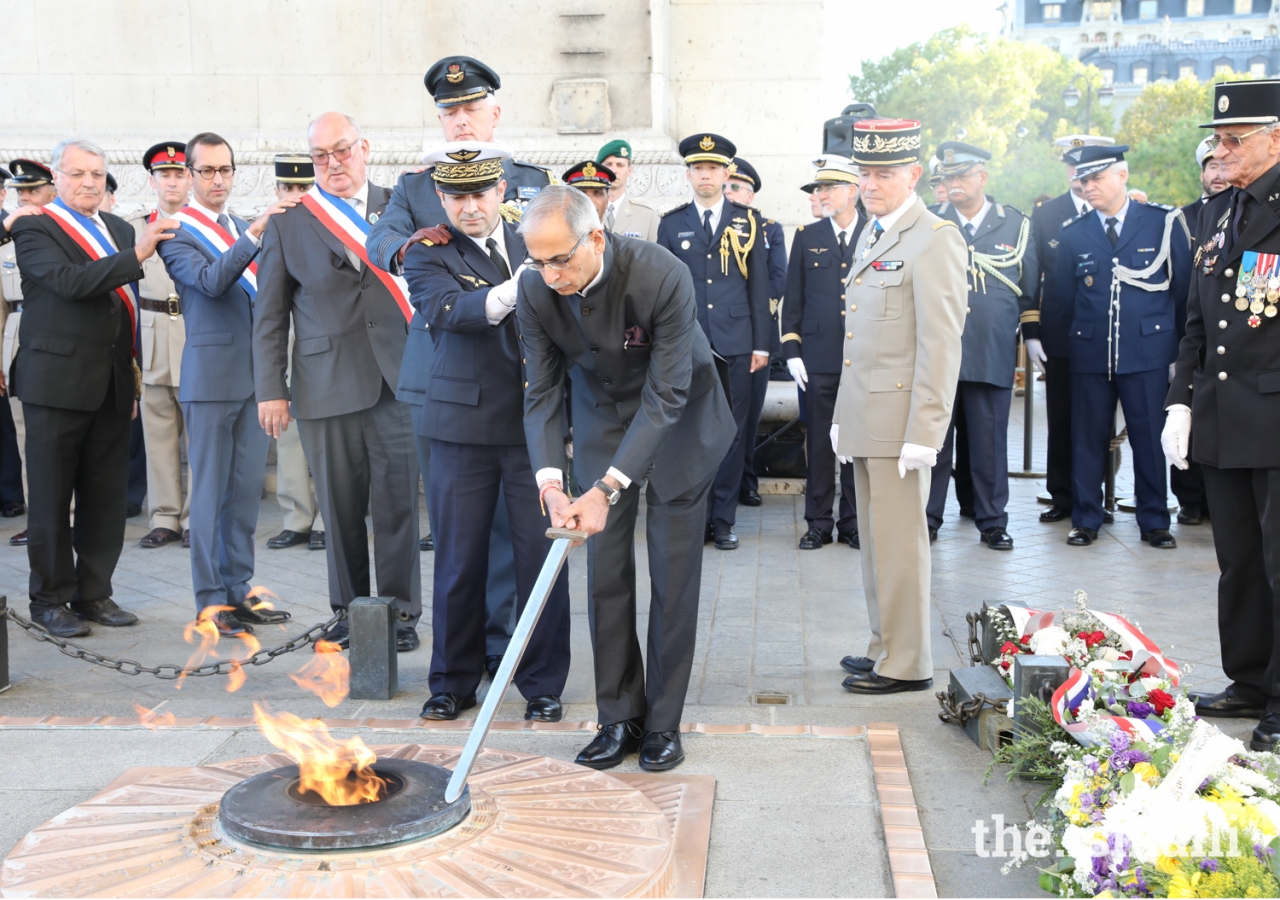The Indian Ambassador in France reignites the flame at the Tomb of the Unknown Solder at the Arc de Triomphe in Paris.