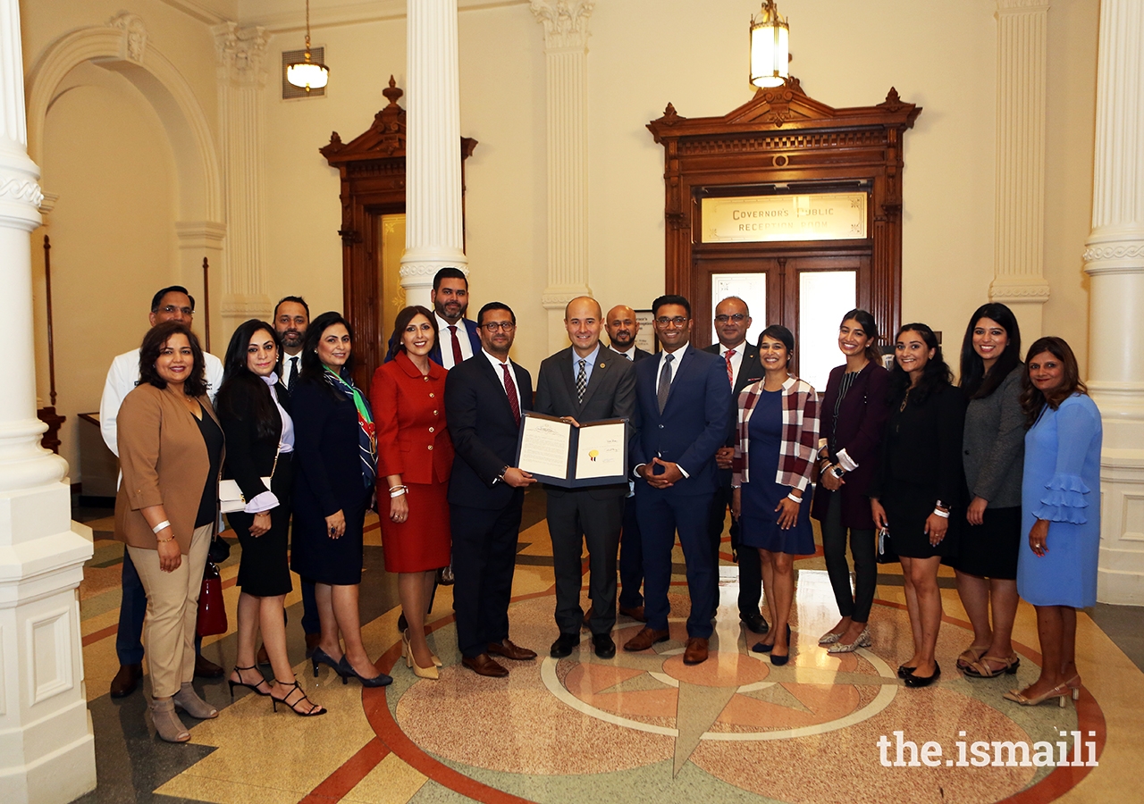 Texas State Representative Jacey Jetton presenting a Resolution to Ismaili Council for the Southwestern US President Murad Ajani, who is accompanied by a number of volunteers from the Ismaili community whose collective efforts to support the community-at-large over the past year were recognized.