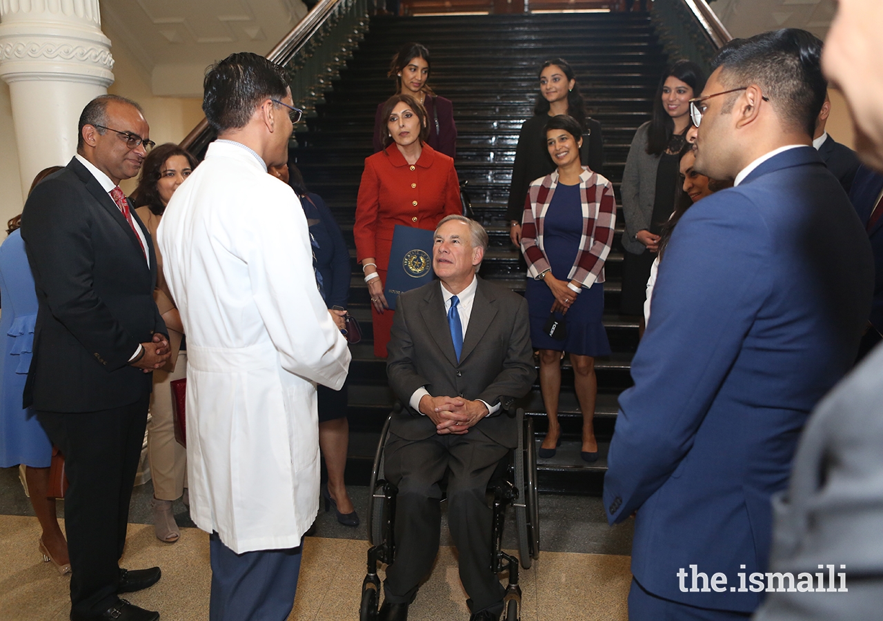 Texas Governor Greg Abbott speaking with volunteers from the Ismaili community whose collective efforts along with many more volunteers were being recognized by the Governor.