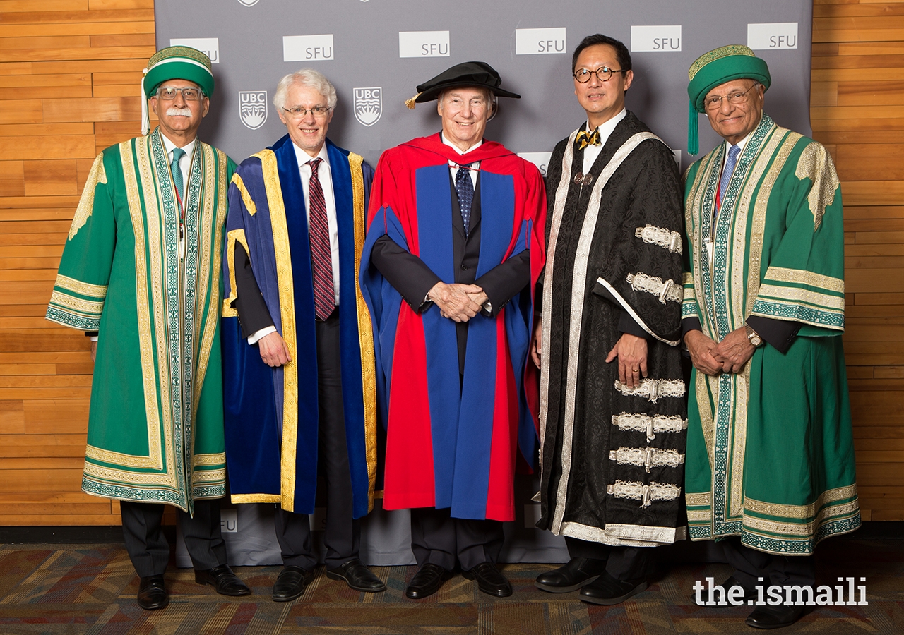 AKU President Firoz Rasul, SFU President and Vice-Chancellor Andrew Petter, Mawlana Hazar Imam, UBC President and Vice-Chancellor Santa Ono, and University of Central Asia Board of Trustees Chairman Shams Kassim-Lakha pose for a ceremonial picture.