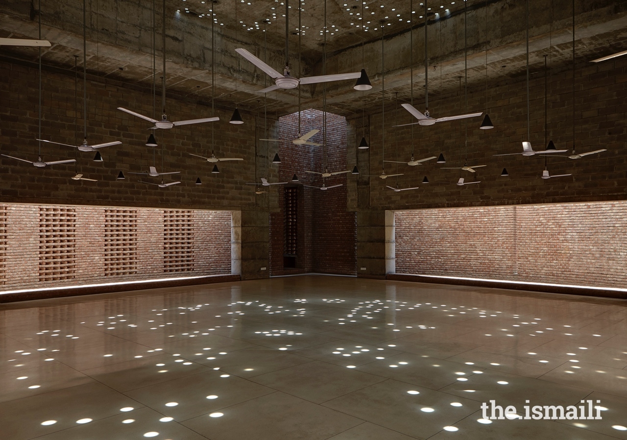The Bait Ur Rouf Mosque in Dhaka, Bangladesh. Random circular roof openings allow daylight into the prayer hall creating an ornate pattern on the floor, enhancing spirituality through light.