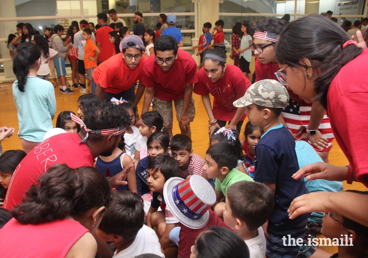 Group of counselors in Atlanta with participants during arrival playing Magic Box Activities.