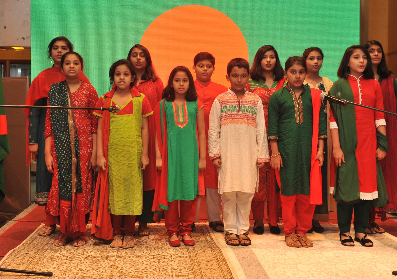 Students from the Aga Khan School, Dhaka, recite the National Anthem