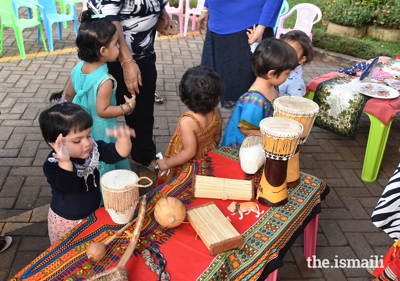 Children participate in Cultural Day, where students and teachers displayed flags, artifacts, currencies, and attire from different countries and dressed in traditional clothing representing the different cultures and traditions.