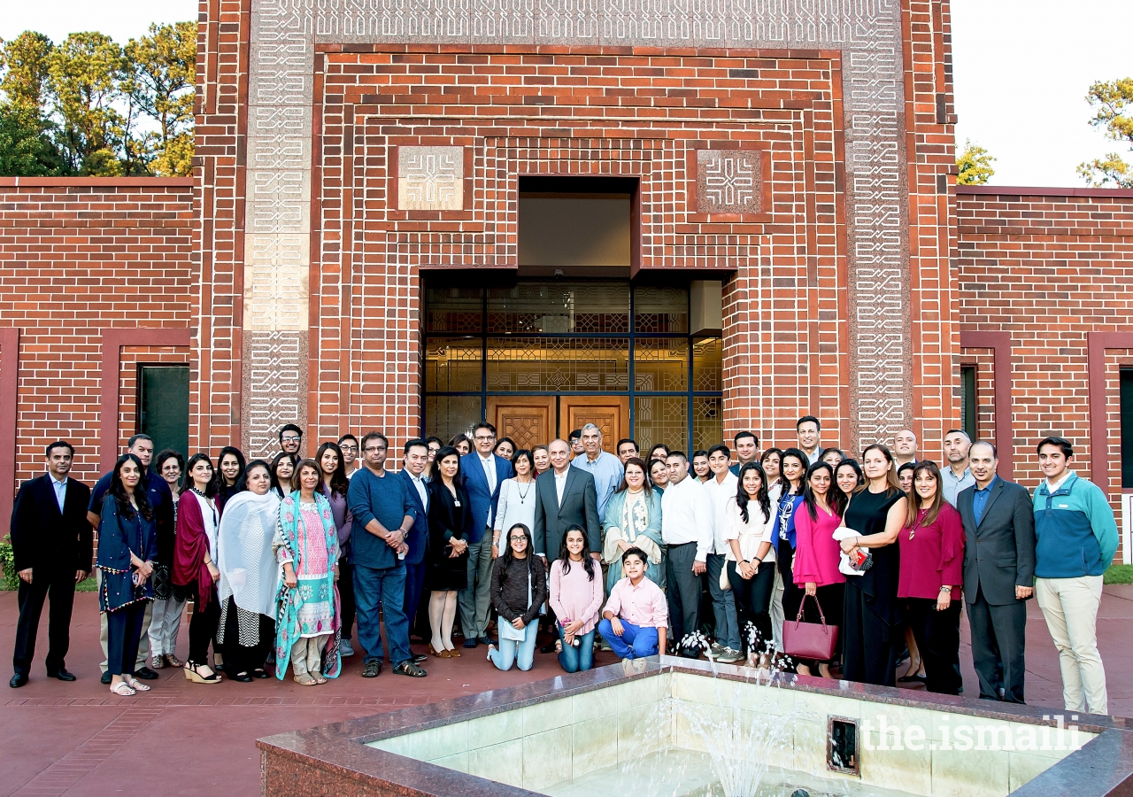 Group photo of members of the Ismaili Jamatkhana in Decatur, Georgia with its architect, Farouk Noormohamed.