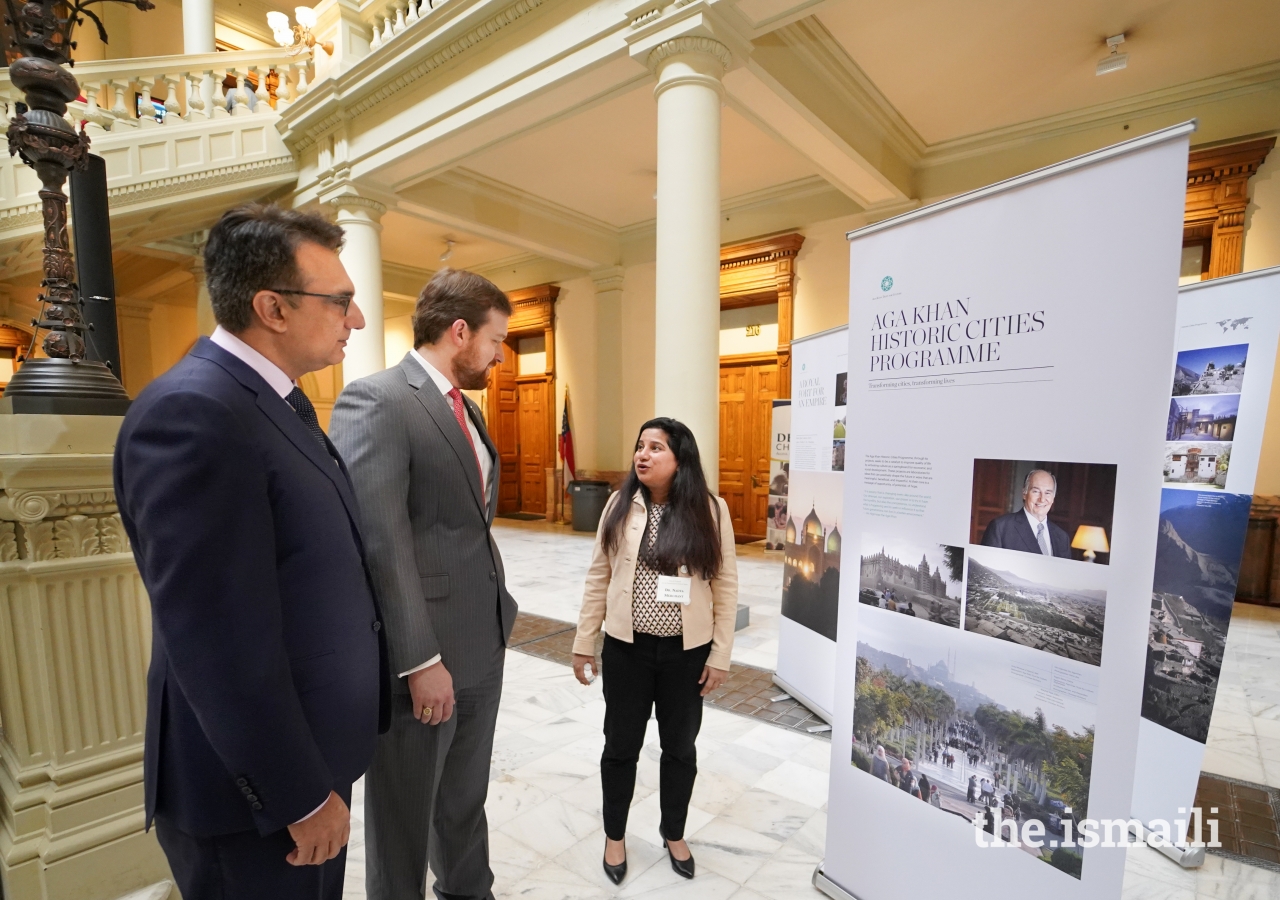 President Murad Abdullah joins Dr. Nadya Merchant while she gives a tour of the exhibition to Georgia House and Senate representatives and guests visiting the State Capitol.