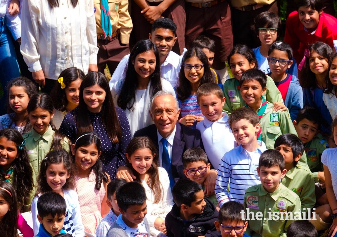 His Excellency Marcelo Rebelo de Sousa, President of the Portuguese Republic, surrounded by young Ismailis in the Garden of Fruits at the Ismaili Centre Lisbon.