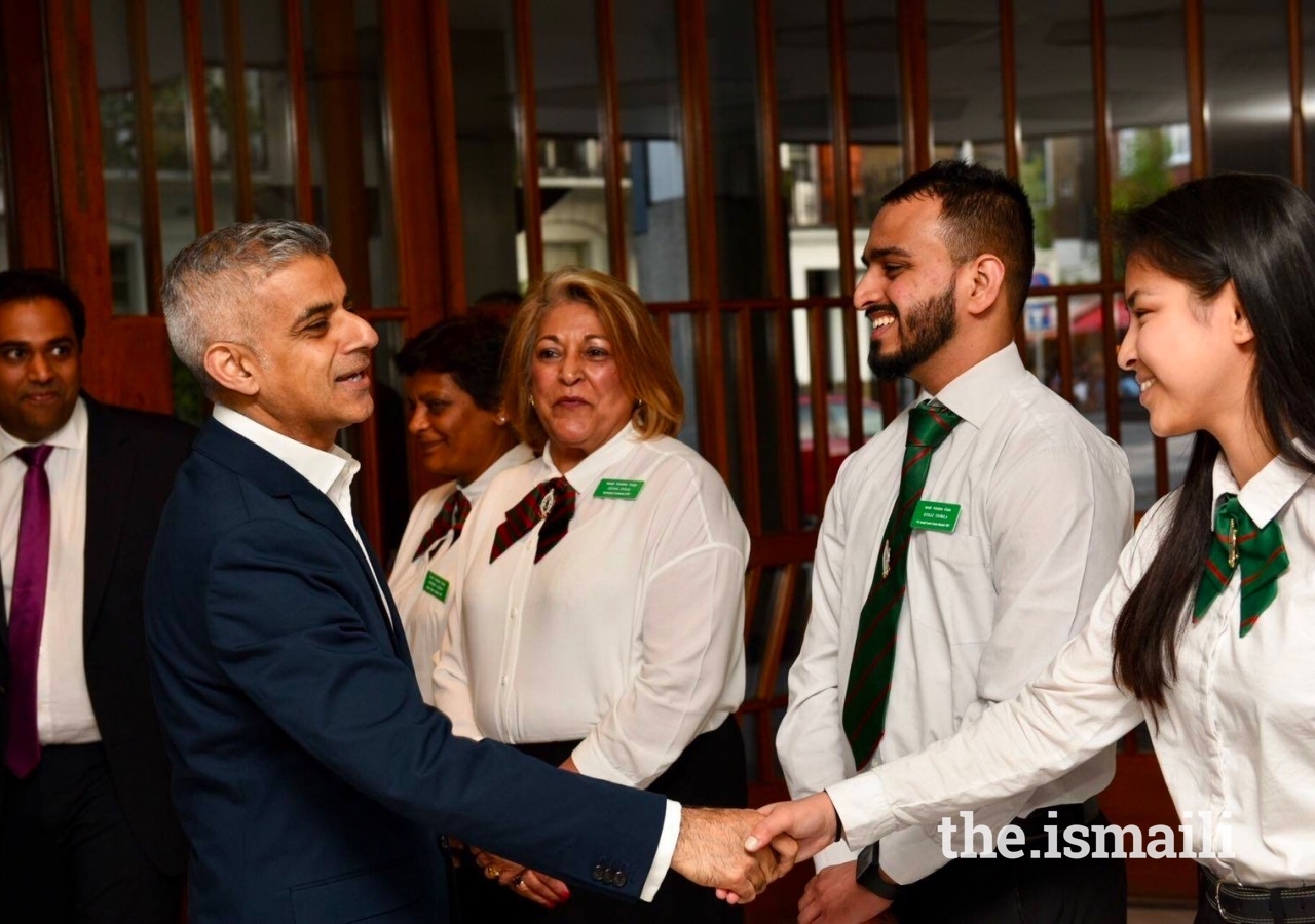 Mayor of London Sadiq Khan is greeted by young members of the Ismaili Volunteer Corps at the Ismaili Centre London.