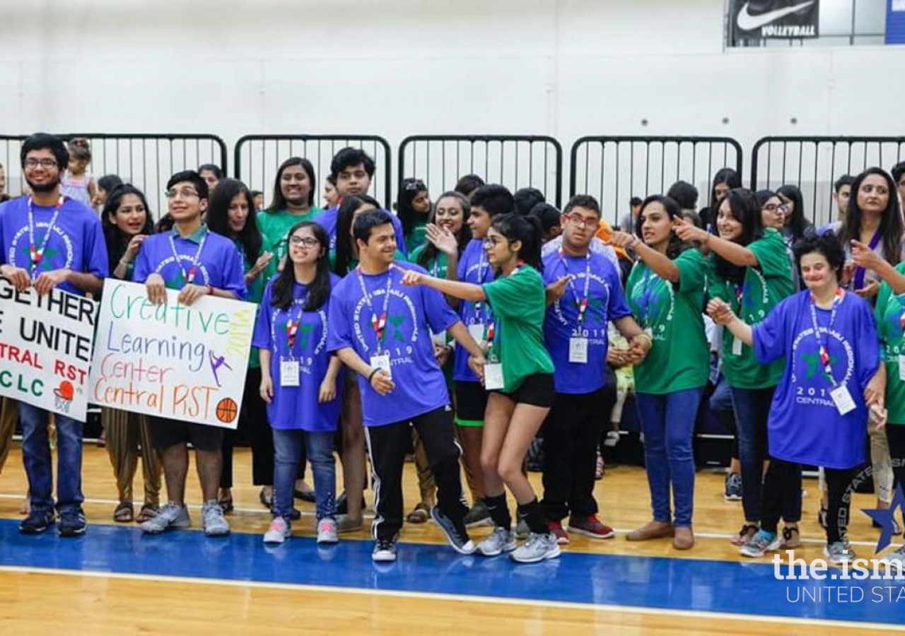CLC participants cheer for the Central region teams during the sports tournament. 