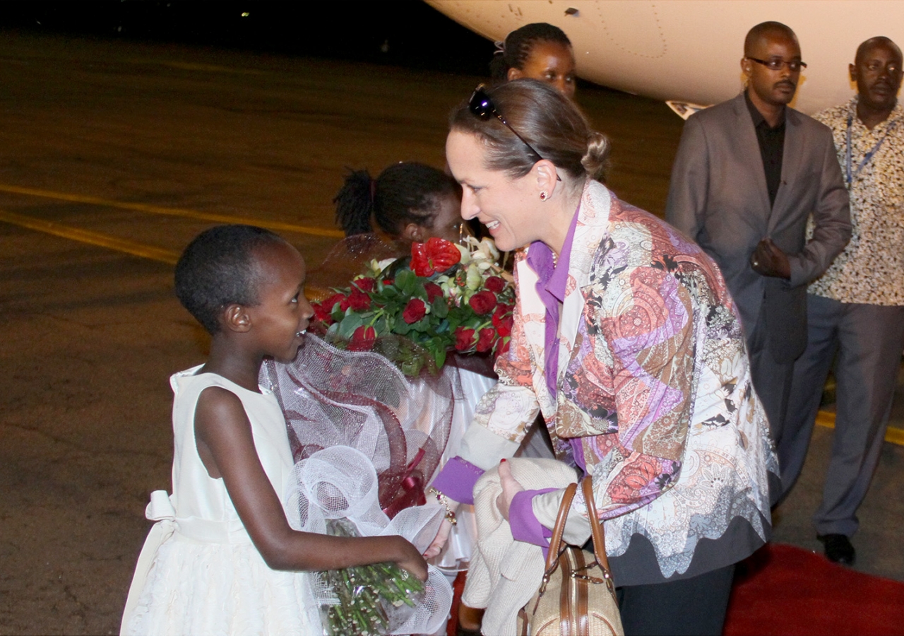 Princess Zahra is presented with flowers upon her arrival in Uganda. MOFA / Fahad Mugga