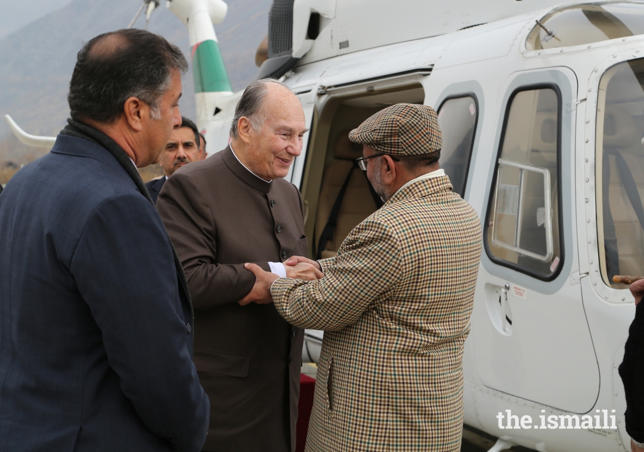 Mawlana Hazar Imam is greeted by Syed Zaheerul Islam, Commissioner, Malakand Division upon his arrival at the Chitral Town Airport