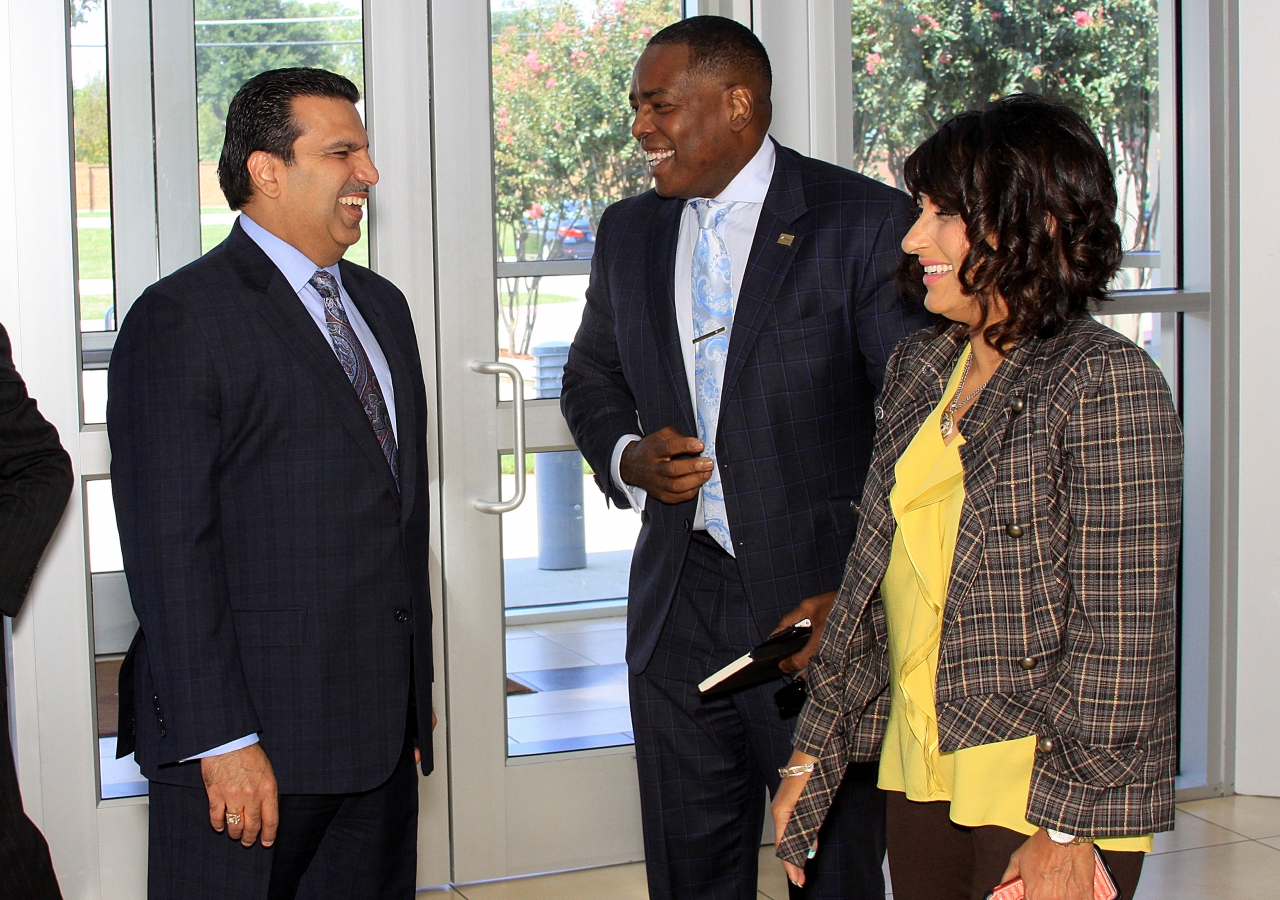 Mayor of Plano, Harry LaRosiliere, sharing a light moment with the leaders.