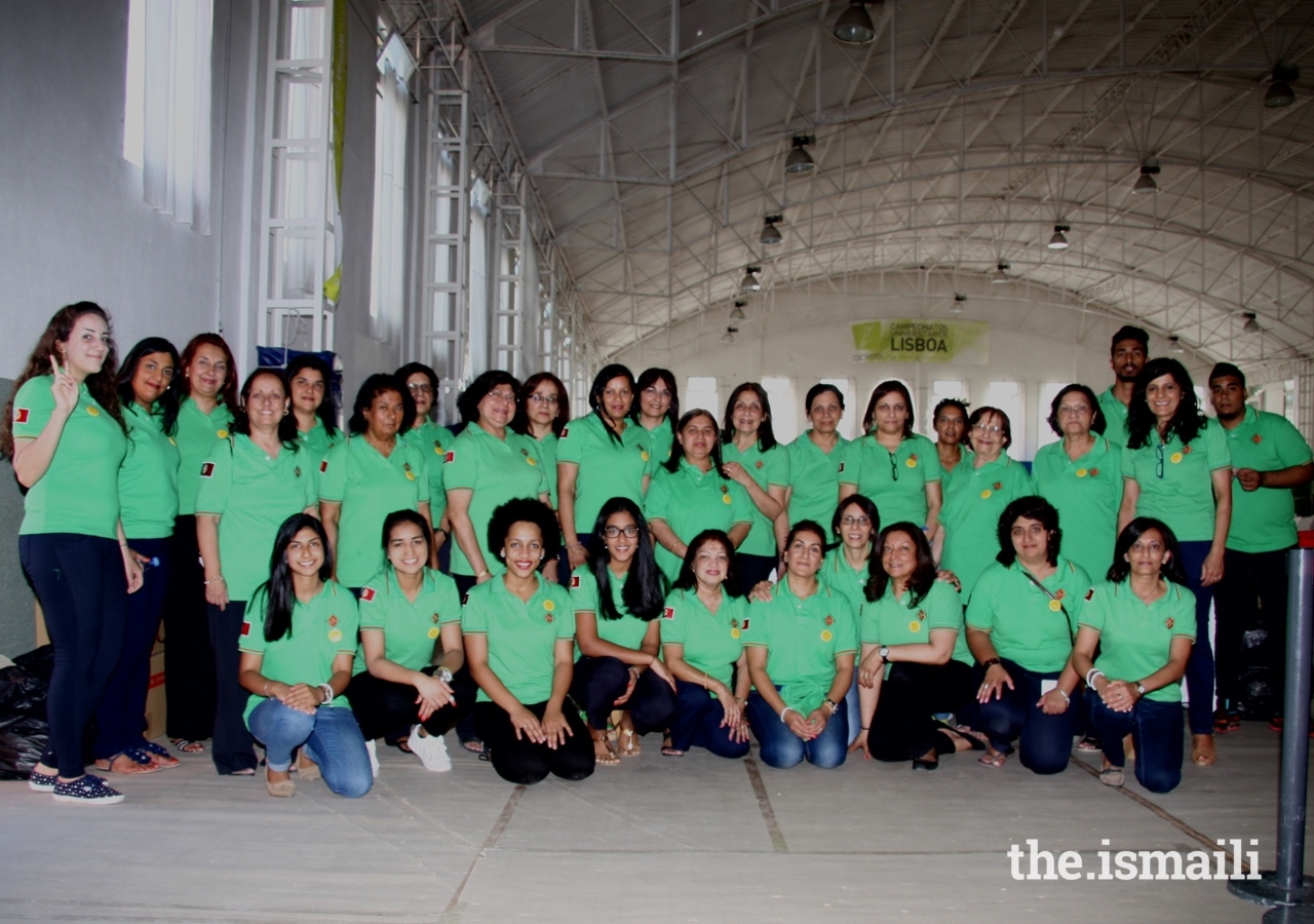 Volunteers in Lisbon prepare for the Imamat Day celebration in 2016.